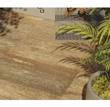 Terras met vloertegels en decoratief tapijt