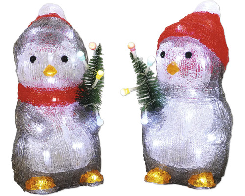 Twee decoratieve pinguïns met muts en kerstboom