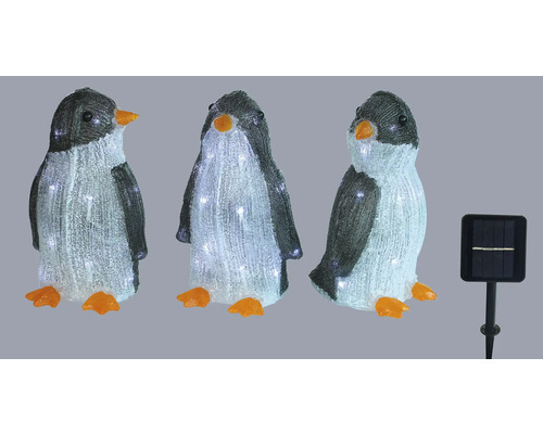Drie pinguïnfiguren met zonnepaneel voor buiten