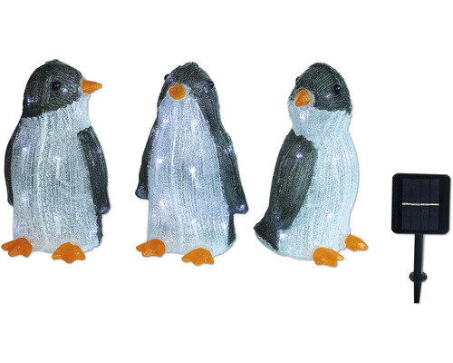 Drie pinguïnfiguren met zonnepaneel ter decoratie