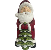 Kerstmanbeeldje met kerstboom