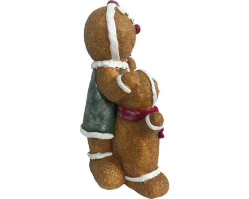 Decoratieve peperkoekmannetjesfiguren omhelzen elkaar