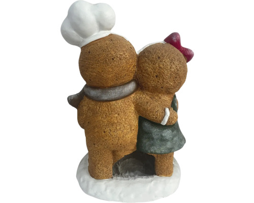 Decoratieve peperkoekfiguren die elkaar omarmen, een bakker met een koksmuts en een meisje met een strik