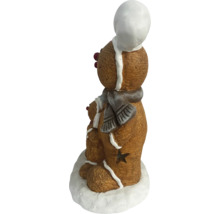 Decoratieve peperkoekfiguren met sjaal en muts
