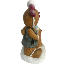 Decoratief peperkoekmannetje met hart en ster voor de kerstperiode