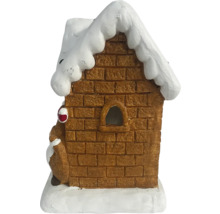 Decoratief peperkoekhuis met sneeuw op het dak.