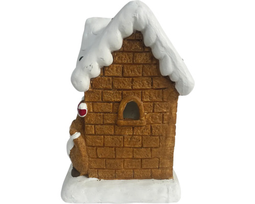 Decoratief peperkoekhuis met sneeuw op het dak.