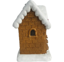 Decoratief peperkoekhuis met baksteenpatroon en sneeuw