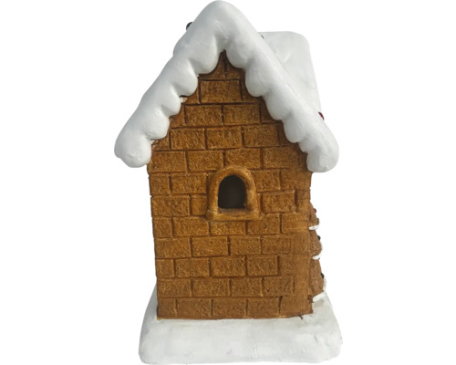 Decoratief peperkoekhuis met baksteenpatroon en sneeuw