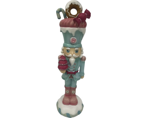 Decoratieve notenkrakerfiguur met snoepversieringen voor een feestelijke kerstsfeer