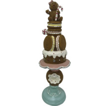 Decoratief snoepfiguur met peperkoekmannetje, macarons en donut