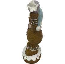 Peperkoekmannetjesfiguur met muts als kerstdecoratie