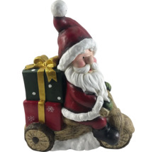Kerstmanfiguur op houten voertuig met geschenken