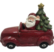 Kerstdecoratie: Kerstman in auto met kerstboom