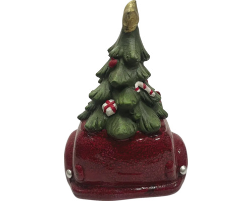 Decoratieve kerstboomfiguur op rode auto