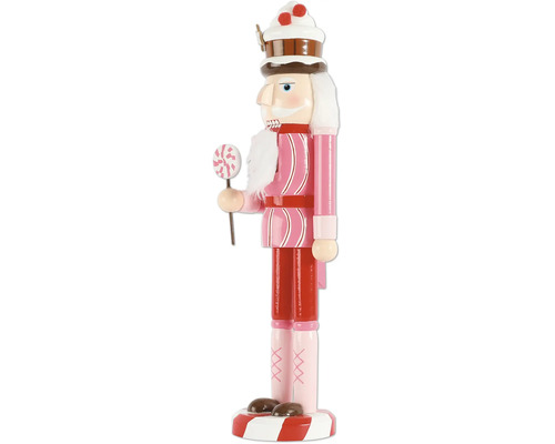 Decoratieve notenkraker met snoep en een muts in de vorm van een taart