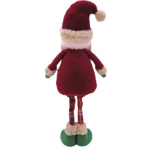 Achteraanzicht van een kerstman decoratiefiguur met rode jas, geruite broek en muts