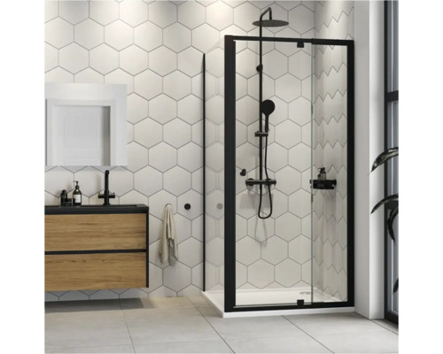 Moderne badkamer met douchecabine, wastafel en zeshoekige wandtegels.