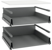 Twee grijze lade-inzetstukken met uittrekrails en een wit tafelblad.