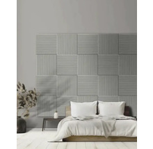 Slaapkamer met akoestische panelen aan de wand achter het bed