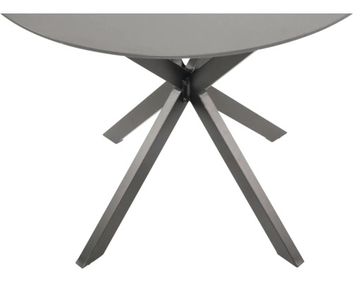 Detail van een ronde tafel met metalen frame