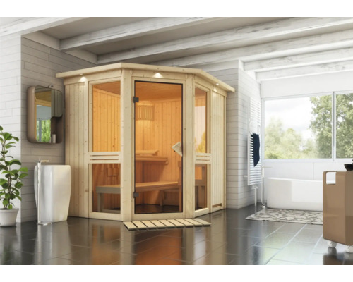 Houten sauna met glazen deur in een badkamer met wastafel en bad.