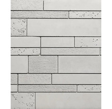 Close-up van een wandbekleding van beton met verschillende texturen en afmetingen