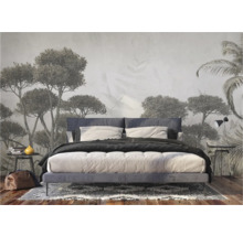 Slaapkamer met fotobehang met boommotieven en tweepersoonsbed