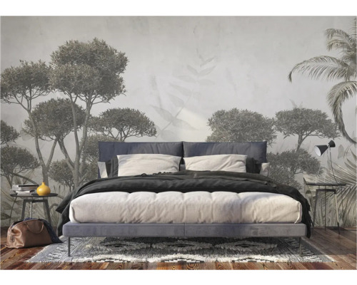 Slaapkamer met fotobehang met boommotieven en tweepersoonsbed