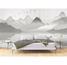 Slaapkamer met fotobehang met berglandschap en meer