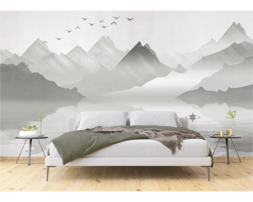 Slaapkamer met fotobehang met berglandschap en meer