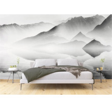 Slaapkamer met fotobehang berglandschap boven het bed