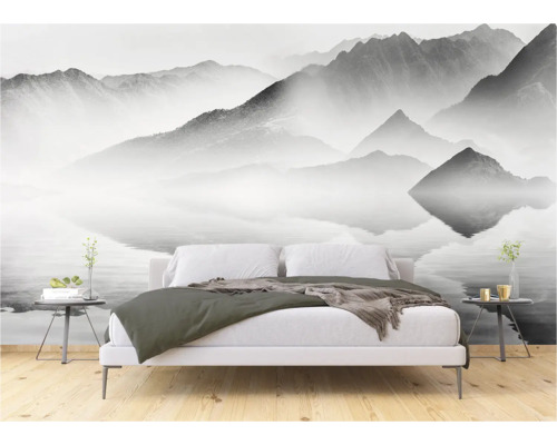 Slaapkamer met fotobehang berglandschap boven het bed