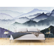 Slaapkamer met een fotobehang met bergmotief