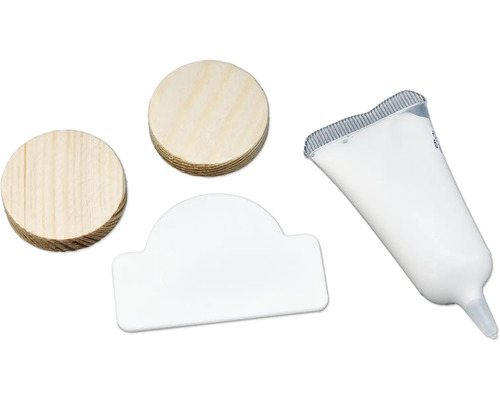 Twee houten deuvels, een witte afdekkap en een tube lijm