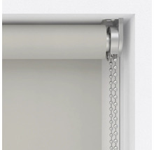 Detailopname van een rolgordijn met kettingbediening bij het raam