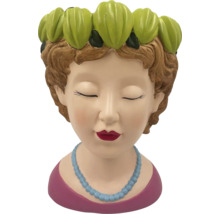 Decoratieve plantenschaal in de vorm van een vrouwenhoofd met bloemdecoratie