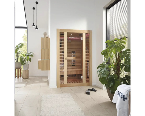 Badkamer met infraroodsauna, wastafelcombinatie en kamerplanten voor een ontspannen sfeer