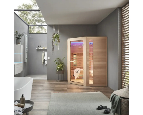 Badkamer met infraroodsauna, bad en douche voor ontspannende momenten