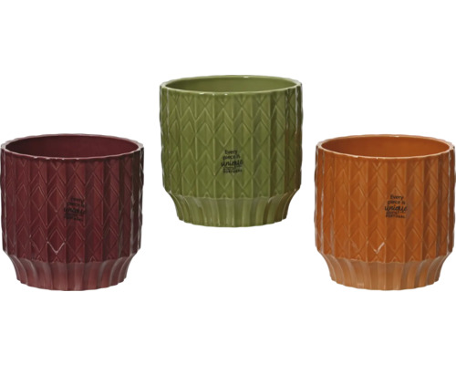 Drie keramische bloempotten met geometrisch patroon