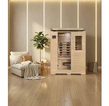 Infraroodsauna met zitbank en infraroodlampen in een lichte kamer met houten vloer