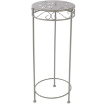 Metalen decoratieve zuil met plantenpatroon op het tafelblad