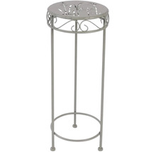 Plantenstandaard van metaal met patroon op het tafelblad