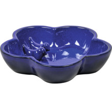 Blauw keramisch vogelbad in bloemvorm
