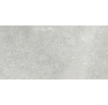 Close-up van een vloertegel met gespikkelde textuur