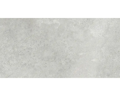 Close-up van een vloertegel met gespikkelde textuur