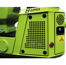 Detailopname van een Zipper werkmachine met ventilatieroosters en waarschuwing