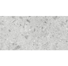 Close-up van een vloertegel met terrazzo-effect