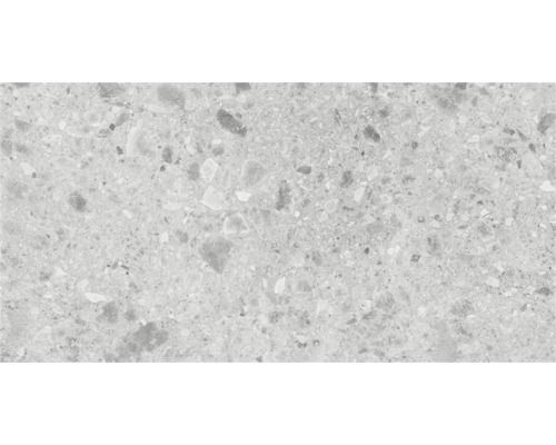 Close-up van een vloertegel met terrazzo-effect