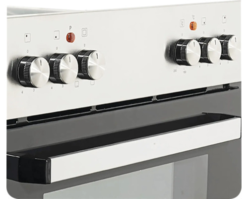 Close-up van een fornuis met draaiknoppen